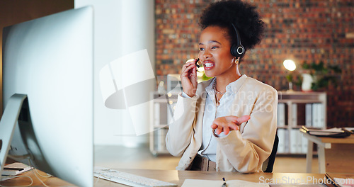 Image of African woman, call center and computer in night, office or talk for telemarketing, voip mic or contact us. Consultant, crm and tech support agent for customer care, thinking or question at help desk