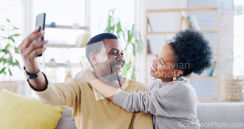 Image of Happy African couple, selfie and sofa with hug, smile and post on web blog, love and bonding in home. Black woman, man and memory with photography, profile picture or romance on social media on house