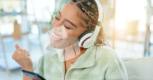 Image of Phone, dance and happy woman on music headphones in home living room. Smartphone, radio and excited African person listening to podcast, audio and sound for freedom, celebration and streaming online