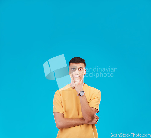 Image of Thinking, mockup and young man in studio with decision, brainstorming or solution expression. Problem solving, idea and male model from Canada with reflection, memory or question by blue background.