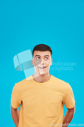 Image of Man, face and thinking of idea with wow expression, surprised or open mouth in studio on blue background. Fashion, emoji and person on mock up space for deal, sale or discount announcement or news
