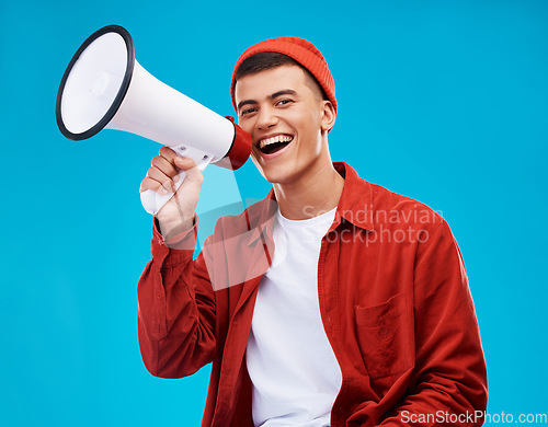 Image of Portrait, megaphone and man with a smile, equality and promotion with a speech on a blue background. Person, activist and model with a bullhorn, change and happiness with freedom and mockup space