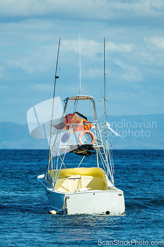 Image of Motor boat anchored on Ocotal beach, Pacific ocean, El Coco Costa Rica