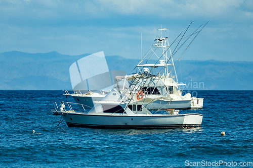 Image of Motor boat anchored on Ocotal beach, Pacific ocean, El Coco Costa Rica