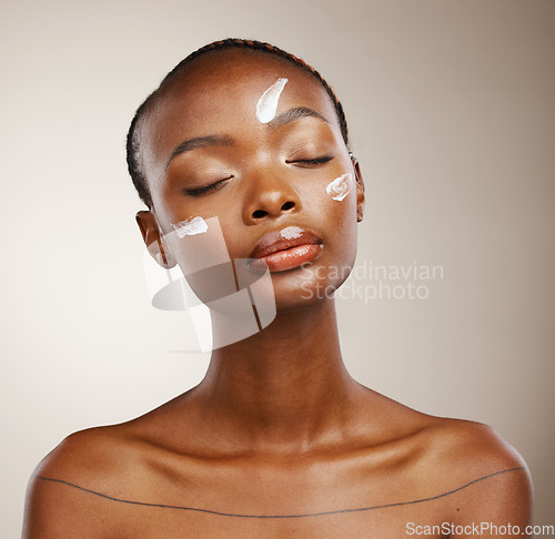 Image of Beauty, self care or black woman with skincare, cream or dermatology on grey studio background. African person, girl or model with creme, aesthetic or cosmetics with luxury grooming and spa treatment