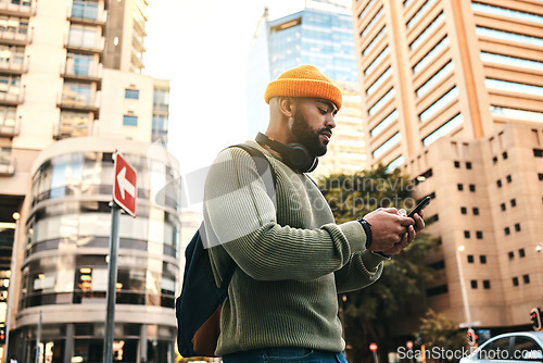 Image of City, phone and man typing, walking and check email, mobile communication or app notification on morning journey. Smartphone, connectivity and person contact social media user on street, road or trip