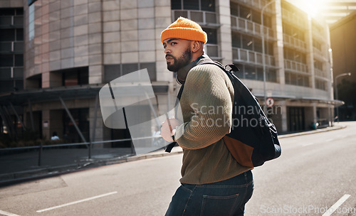 Image of City, walking and man travel, look and check for traffic, transportation vehicles or cars on morning journey. Chicago, outdoor and urban commuter, pedestrian or person cross street, road or sidewalk