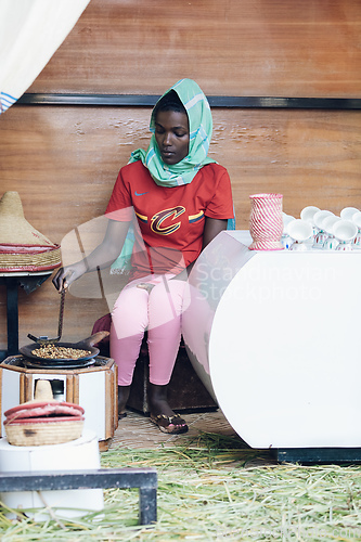 Image of women preparing traditional bunna coffee, Ethiopia