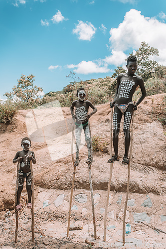 Image of Boys with stilts from Bana tribe, Key Afer, Ethiopia