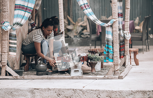Image of Women preparing traditional bunna coffee, Jinka, Ethiopia
