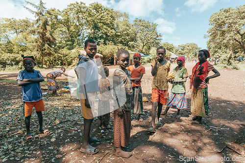 Image of Ethiopian teenager boys posing to tourists