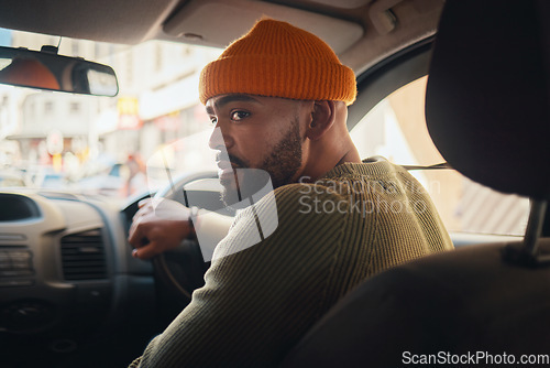 Image of Driving, taxi and man in a car for transportation, location search and in traffic in the morning. Thinking, driver and a person on a journey in transport for travel, commute or parking in the street