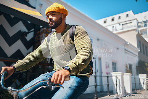 Image of Bicycle, travel and man in city for transport, adventure and journey for weekend, holiday or vacation. Fashion, style and person on bike for eco friendly commute, carbon footprint and cycling in road