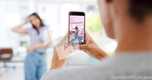 Image of Phone, woman and influencer recording video for social media, vlog or online post dancing at home. Hands, cellphone and female content creator live streaming and moving to music in living room.