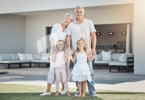 Image of Smile, portrait and grandparents with girl children in the backyard of family home in Australia. Happy, love and kids bonding and having fun with grandmother and grandfather in garden at modern house