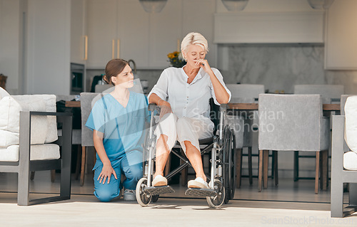 Image of Wheelchair, assisted living or support with an old woman and caregiver in a nursing home for empathy. Pain, loss or grief with a young nurse and senior patient with a disability together for care