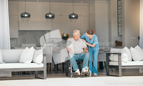 Image of Woman, doctor and elderly care with wheelchair for support, trust or nursing in retirement or old age home. Female nurse or caregiver talking to senior man or person with a disability in living room