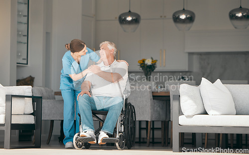 Image of Woman, doctor and wheelchair in elderly care for nursing, support or trust in retirement or old age home. Female nurse or caregiver talking to senior man or person with a disability in living room