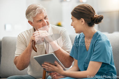 Image of Woman, nurse and tablet in elderly care, consultation or visit in retirement home for healthcare advice. Female person or medical caregiver talking to retired man or patient with technology on sofa