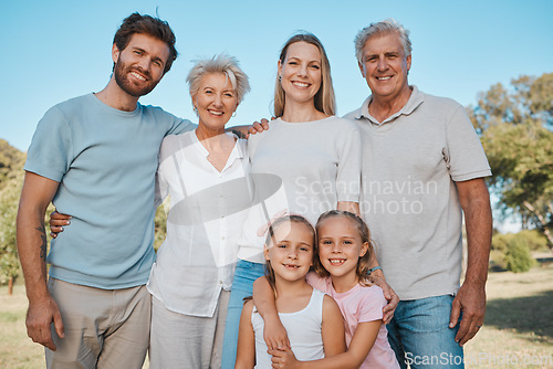 Image of Nature portrait, hug and happy family children, parents and senior grandparents enjoy reunion with mom, dad and kids. Park, love and relax people bonding, care and embrace young sisters in Australia