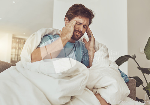 Image of Stress, headache and sick man on a sofa with burnout, vertigo or pain from insomnia at home. Anxiety, migraine and male person in a lounge with temple massage for dizziness, congestion or head cold