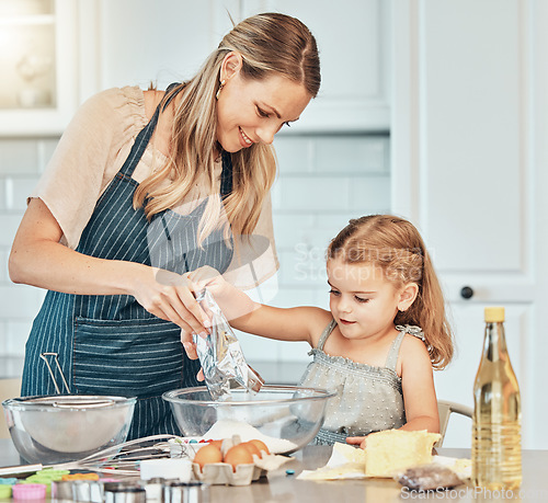 Image of Mom, girl kid and teaching for cooking, development and skills with bonding, love and care in family home. Baking, mother and daughter with bowl, flour and eggs on table, kitchen and helping for food