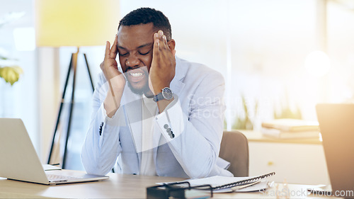 Image of Business man, headache and stress on laptop for stock market crash, financial mistake or error in office. Frustrated worker or african trader with depression, pain or tired for trading or job crisis