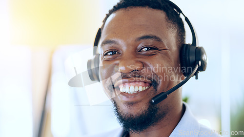 Image of Portrait, call center and happy black man in telemarketing, support and help desk in office. Customer service, sales agent and face of African consultant, business professional and smile in Nigeria