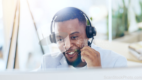 Image of Call center, computer and happy black man talking for telemarketing, crm support and contact at help desk in office. Customer service, sales agent and consultant in communication, advice and business