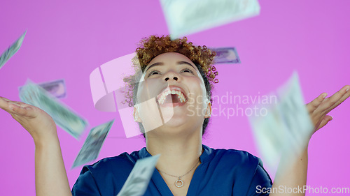 Image of Woman, winner and wow for money rain success, bonus or winning of lottery prize, profit or cashback in studio. Happy african person, cash in air and financial freedom or celebrate on pink background