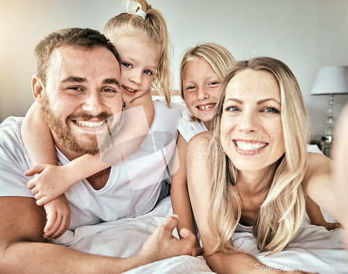 Image of Selfie, smile and portrait of family on the bed for bonding and relaxing together at modern home. Happy, love and girl children laying and taking a picture with parents from Australia in bedroom.