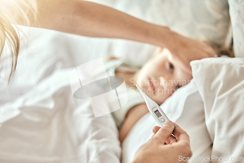 Image of Parent, hands and thermometer with sick child in bed for fever, cold or flu virus at home. Closeup of mother checking child with illness for temperature or measurement in bedroom or rest at house