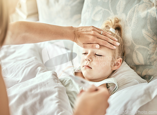 Image of Parent, hands and thermometer with sick kid, fever or flu virus in bed from cold at home. Closeup of mother checking child with illness for temperature or measurement in bedroom or rest at house