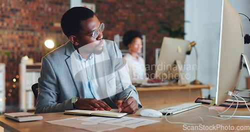 Image of Planning, black man and writing notes in office with business agenda, administration or review of schedule. Businessman, notebook and report on computer research, information or reminder in journal