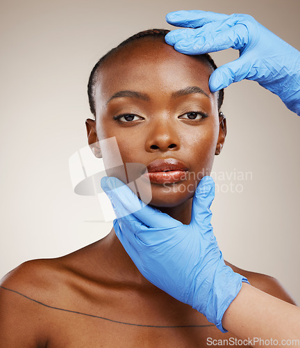 Image of Portrait, hands and plastic surgery with face of a black woman in studio on a gray background for cosmetic transformation. Gloves, beauty and change with a young model ready for facial treatment