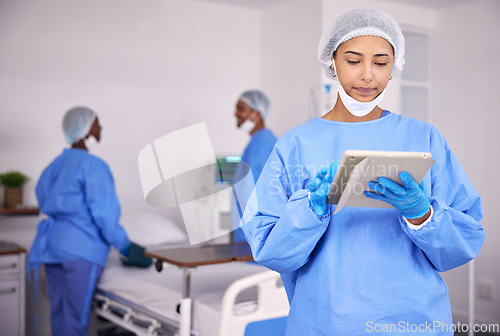 Image of Woman, doctor and tablet in research at hospital for communication, Telehealth or networking at hospital. Female person, medical nurse or professional surgeon with technology for schedule at clinic