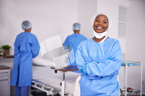 Image of Happy black woman, doctor and arms crossed of professional in ICU, medical or team in healthcare service at hospital. Portrait of African female person, surgeon or nurse smile in confidence at clinic