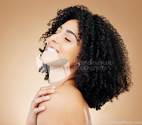 Image of Woman, happy and beauty, hair and natural curls, salon treatment and shine, healthy skin glow on studio background. Skincare, dermatology and clean makeup, haircare and texture with afro and smile