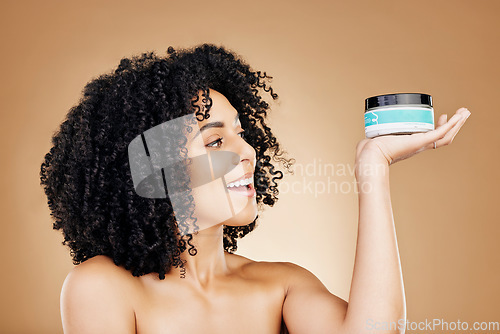 Image of Studio skincare, face and happy woman with cream container, SPF sunscreen or facial melasma prevention. Cosmetics lotion, happiness and person smile for collagen hydration product on brown background