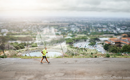 Image of Hiking, walking or man on road, nature or street for trekking journey or workout with urban path. Aerial, holiday vacation or top view of mature hiker outdoor for exercise, fitness or wellness