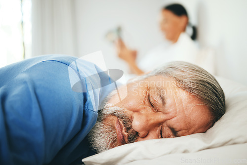 Image of Bed, face and mature man sleeping, tired or nap for stress relief, morning wellness or retirement rest. Fatigue, marriage couple and relax with senior person cozy, dream and exhausted in home bedroom