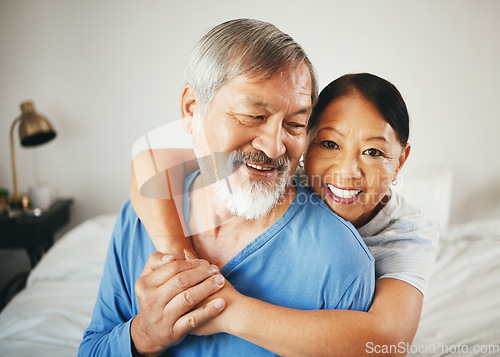 Image of Happy senior couple, hug and love in bedroom for marriage, relationship or care together at home. Mature woman hugging man with smile in happiness for embrace, support or trust on bed in retirement