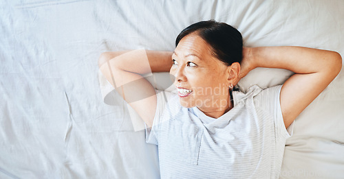 Image of Bed, thinking and happy mature woman sleeping, tired or nap for stress relief, morning wellness or retirement rest. Top view, mockup space and Japanese person relax, daydream or smile in home bedroom