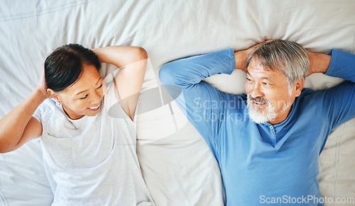 Image of Bed, face and mature Asian couple sleeping, tired or nap for partner care, morning wellness or retirement rest. Top view, smile and old woman, man or marriage people eye contact in Japan home bedroom