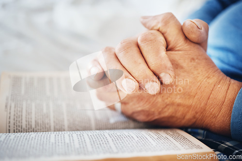 Image of Hands, Bible and pray with God and worship, religion with faith or spiritual, reading scripture for guide and hope. Gratitude, respect and Christian person with healing, wellness and religious book