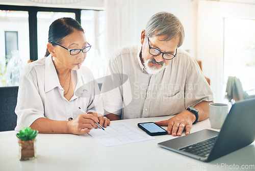 Image of Senior couple, phone and finance in budget planning, invoice or documents together on table at home. Mature man and woman writing in financial plan, expenses or bills with paperwork on desk at house