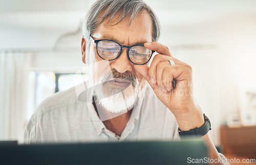 Image of Senior man, glasses and headache on computer for debt, bankruptcy or stock market crash at home. Sad asian person or trader with pain, fatigue or depression reading bad news or trading fail on laptop