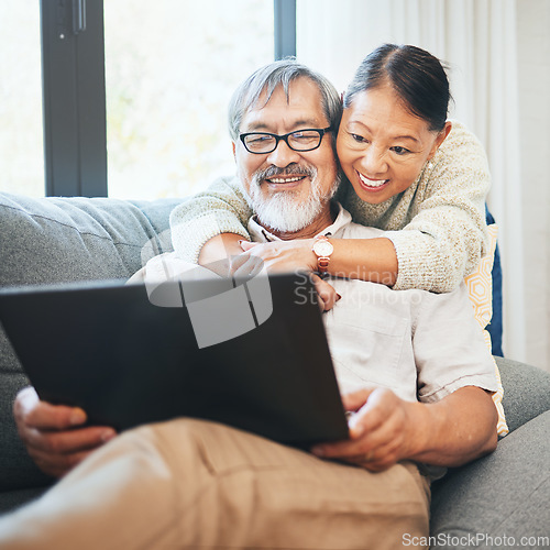 Image of Laptop, smile and senior couple on a sofa watching movie, show or film together in living room. Happy, technology and elderly man and woman in retirement streaming a video on computer at modern home.