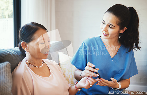 Image of Woman, doctor and senior patient with diabetes for injection, insulin or pen on finger in elderly care at home. Female person, nurse or medical caregiver giving diabetic needle prick for healthcare