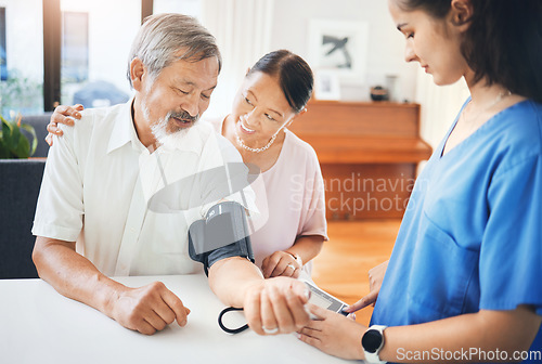 Image of Blood pressure, nurse and senior couple in living room with equipment for hypertension. Sick, doctor and caregiver with medical tool for male patient in retirement in lounge of home for consultation.